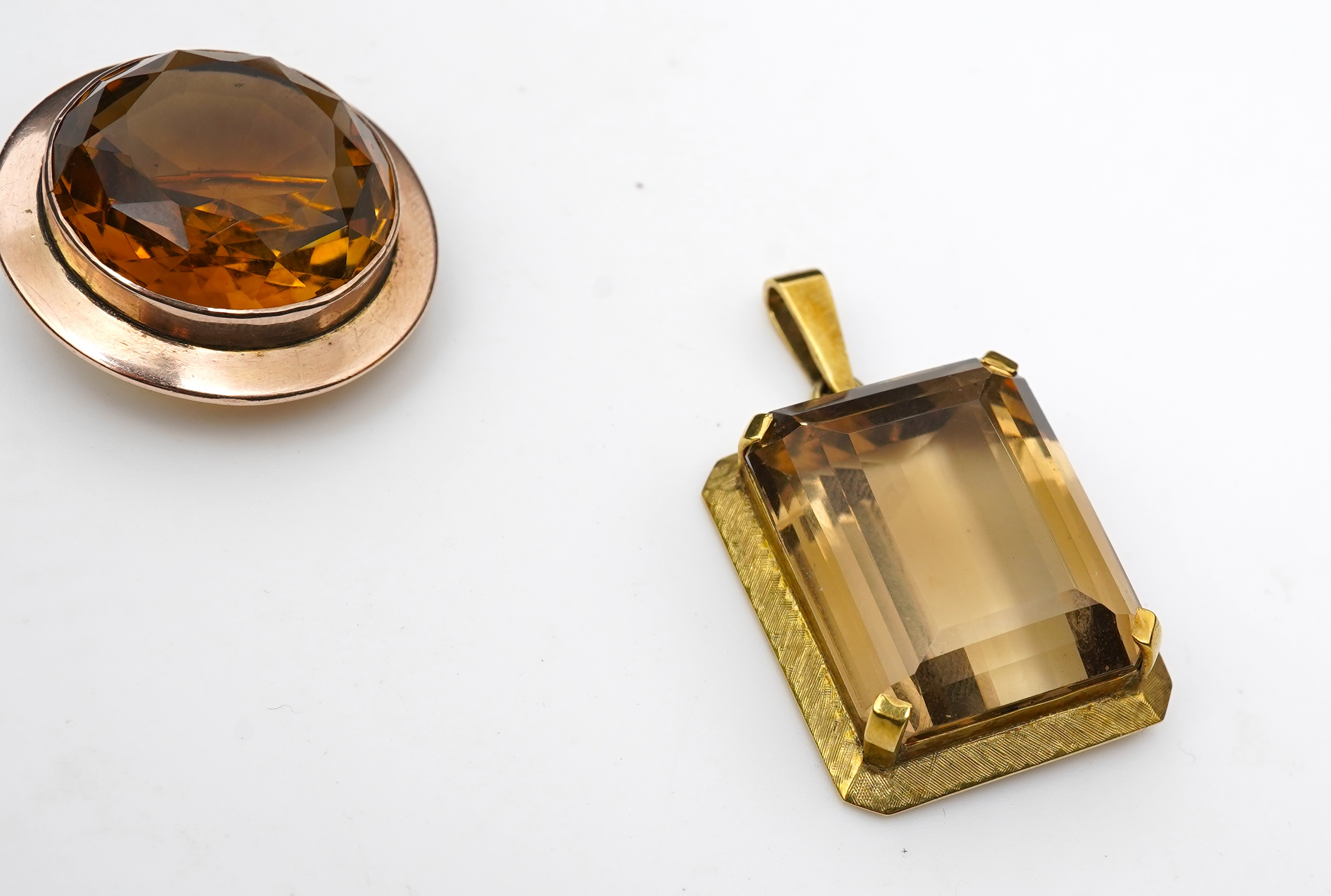 A citrine brooch and pendant, and onyx stickpin